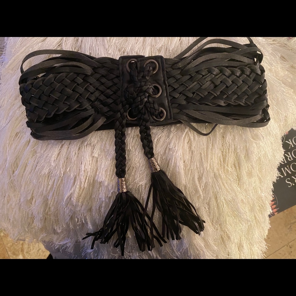 Black wide leather belt that snaps in the back